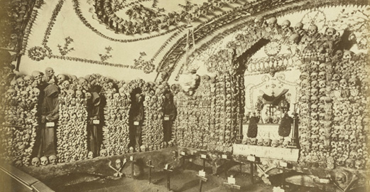 photograph of skulls and crosses inside a convent