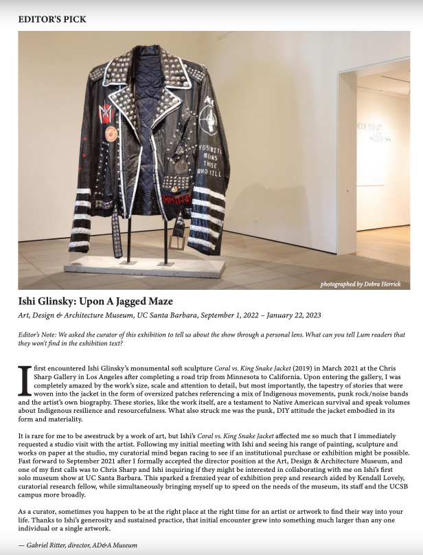 Article with photo of Ishi Glinsky: Upon a Jagged Maze installation (Coral vs. King Snake Jacket pictured).