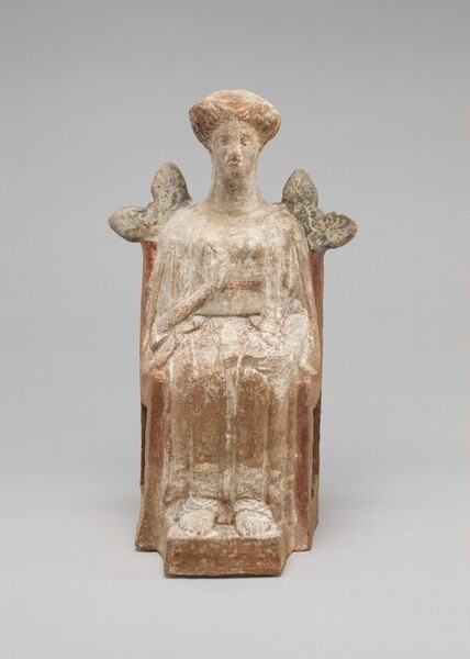 Seated female figure, terracotta, off-white with earthen red coloring